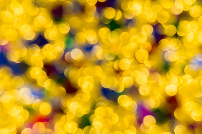 Abstract golden color lights christmas background. de-focused - image