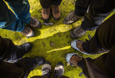 Low section of people standing on field