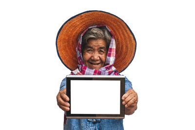 Portrait of mature man using smart phone against white background