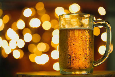 Close-up of beer glass on table