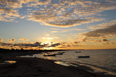 Scenic view of beach against sky during sunset