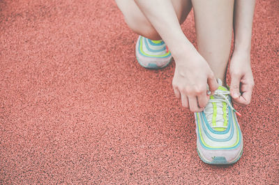 Low section of woman wearing shoes