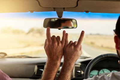 Low section of man in car