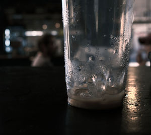 Close-up of drinking glass on table