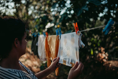 Woman drying clothes