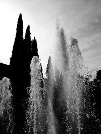 Water splashing against sky