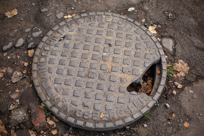 High angle view of manhole on street