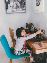 Cute girl playing with toy at home