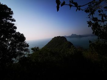 Scenic view of silhouette mountains against sky at sunset