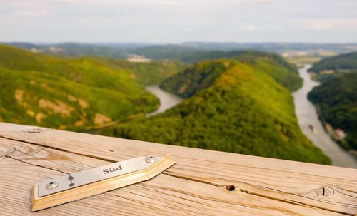 High angle view of table on landscape against sky