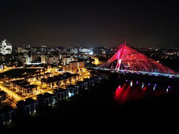 High angle view of illuminated city buildings at night