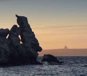 Scenic view of sea at sunset