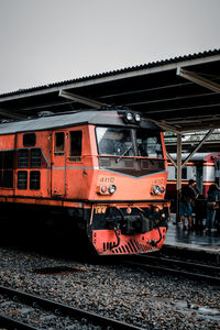 Train on railroad track against clear sky