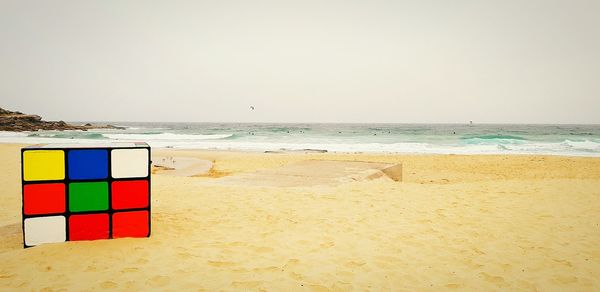 Scenic view of beach against clear sky