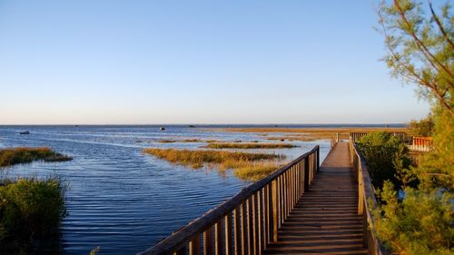 Scenic view of sea against clear blue sky