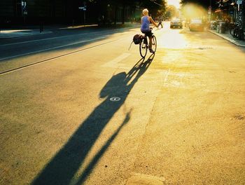 Man riding bicycle on road