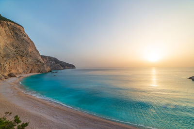 Scenic view of sea against clear sky during sunset