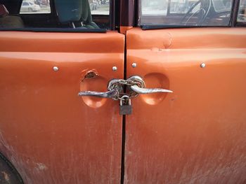 Close-up of red door of car