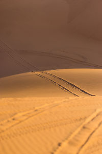 Scenic view of desert against sky during sunset