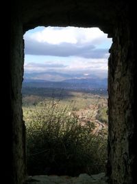 Scenic view of landscape against cloudy sky