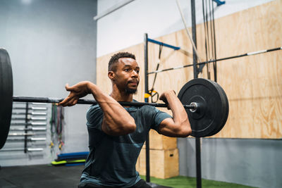 Man lifting weights in gym