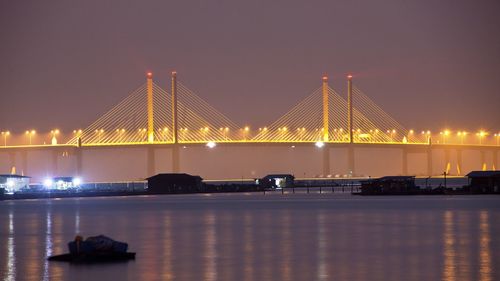 View of suspension bridge at night