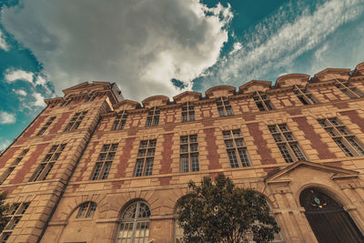 Low angle view of old building against sky