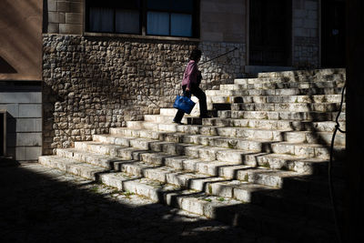 Side view of woman on wall