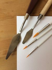 High angle view of paintbrushes on table