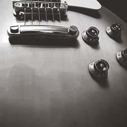 High angle view of guitar on table