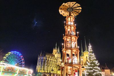 Low angle view of illuminated building at night