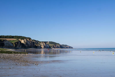 Scenic view of sea against clear blue sky