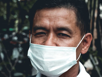 Close-up portrait of a man with mask