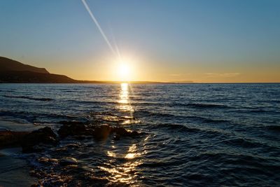 Scenic view of sea against sky during sunset