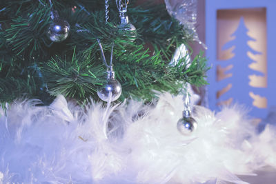 Close-up of christmas decorations hanging on tree