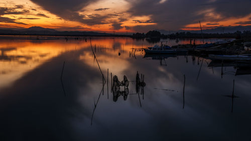 Scenic view of lake against sky during sunset