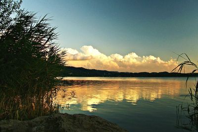 Scenic view of landscape against sky at sunset