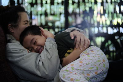 Happy mother and son at home