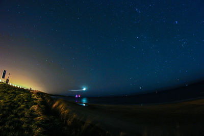 Scenic view of sea against sky at night