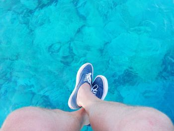 Low section of woman in swimming pool