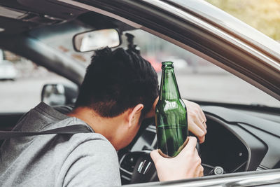 Rear view of man in car