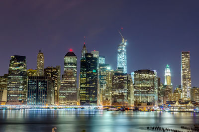 Scenic view at night of modern skyscrapers in lower manhattan, new york city, usa.
