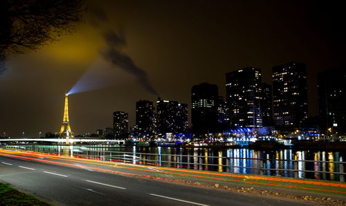 Illuminated road in city at night
