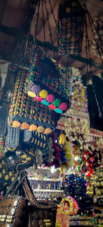 Multi colored decoration hanging on roof against building