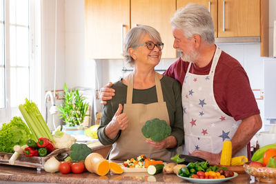 Young woman holding food at home