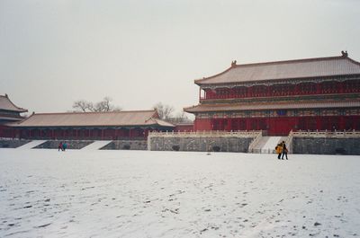 Buildings against sky during winter