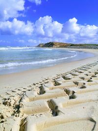 Scenic view of beach against sky