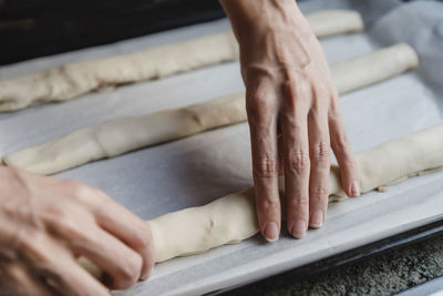 Anonymous housewife making pastry rolls