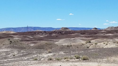 View of desert against blue sky