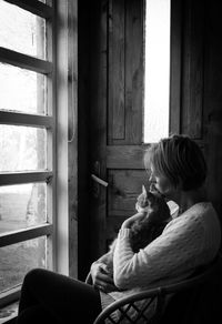 Rear view of couple sitting at home